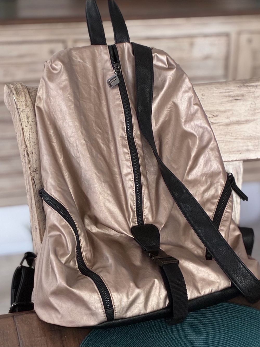 Metallic Rose Gold Backpack with Black Trim by Fabletics. Great yoga/pilates bag